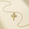 Collier pendentif Croix de Vie Ankh Isis ailée or, fond crème